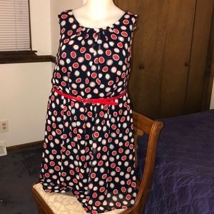 Navy blue dress with white and red polka dots